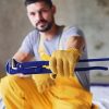 holds-wrench-in-hand-worker-in-yellow-colored-uni-YG7AKFW.jpg